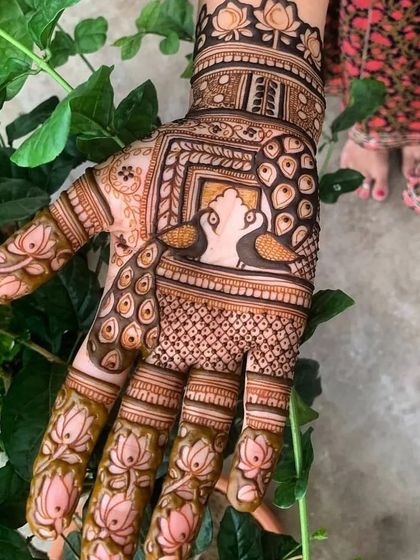 A beautiful design for the back of the hand, featuring swans and lotus motifs, set against a natural green background.