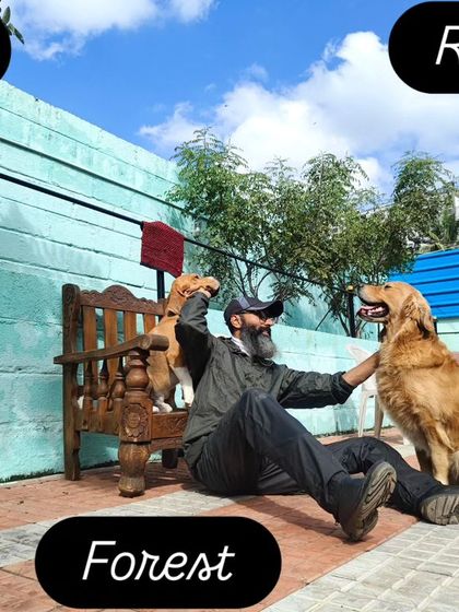 Under the blue skies, sharing love with Leo the Beagle and Rana the Golden Retriever.