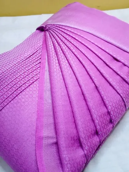 A light purple silk saree with a simple design.