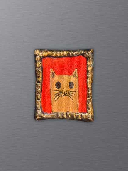 Another one of my feline-inspired creations. This hand-painted cat magnet features a simple design with a vibrant orange background, perfect for any animal lover.