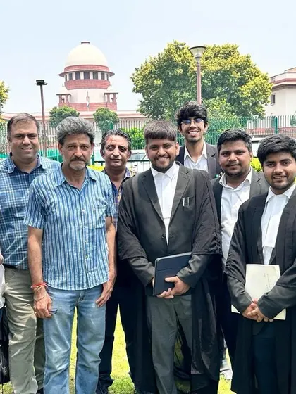 With my team and clients outside the Supreme Court. A united front is essential when fighting for justice in landmark cases.