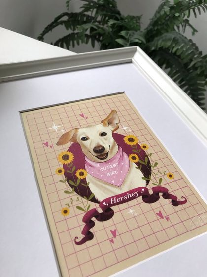 A close-up of the corner of Hershey's framed portrait. The details in the illustration, like the hearts and sparkles, are perfectly clear in the final print.