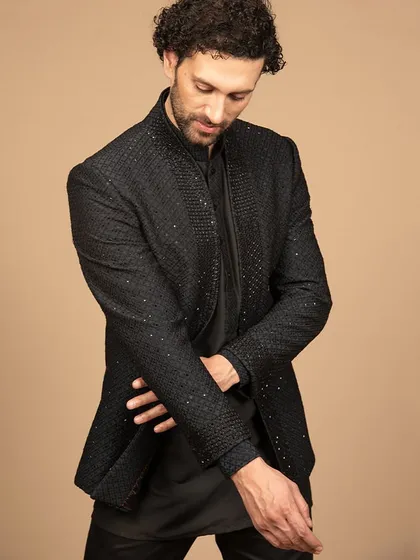 A closer look at the black embroidered Bandhgala, showing the texture and detail. The sleek black color adds a touch of elegance to this modern ethnic piece.