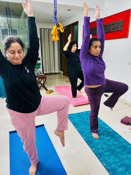 Asana is the easiest way to bring yourself into the present moment. Here, students practice a balancing pose, which requires complete focus. It's a beautiful way to leave the past behind and stop worrying about the future.