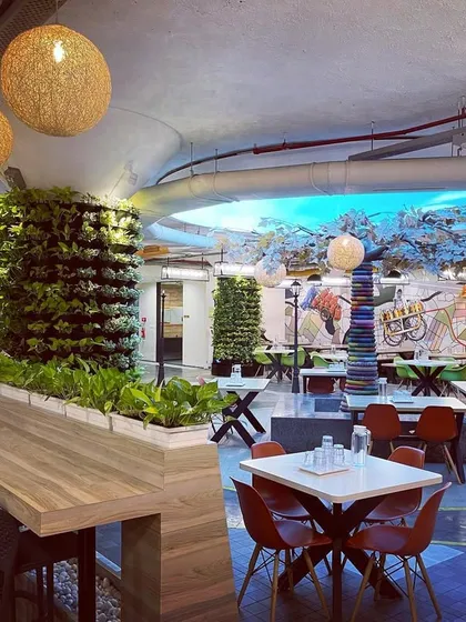 We love a creative challenge, like turning structural pillars in this office cafeteria into living columns of green. This project shows how plantscaping can fundamentally change the atmosphere of a large commercial space, making it more vibrant and welcoming.