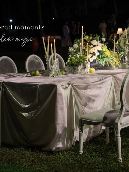 An elegant dinner table at the Goa soirée, with the text overlay "tailored moments, timeless magic".