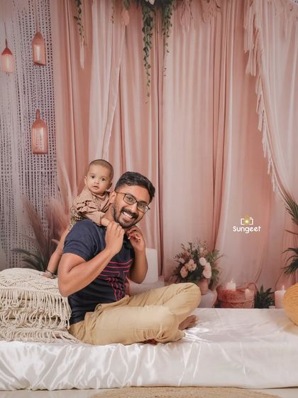 A sweet and playful moment with dad. This photo perfectly captures the special bond and trust between a father and his baby.