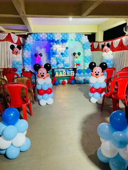 The hall setup for the Mickey Mouse birthday, with balloon pillars lining the aisle for guests.
