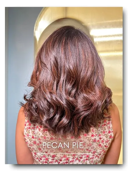 For a cozy and warm look, we created this Pecan Pie color. It features a blend of reddish-brown and golden tones, mimicking the comforting shades of the classic dessert for a truly unique and inviting hair color.