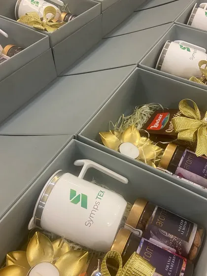 A look inside the Symps TEX corporate boxes, showing how each item is carefully placed to create a visually appealing and organized gift.