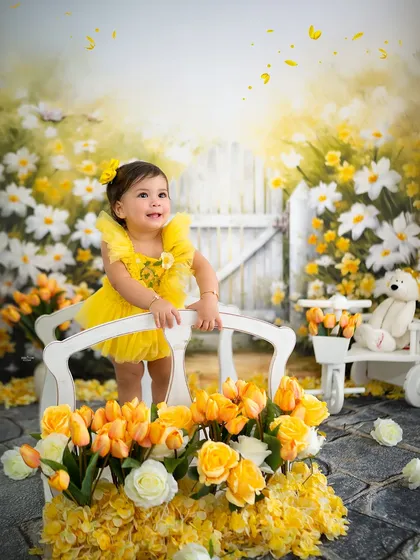 Standing on a little white bridge in her sunshine-yellow garden.