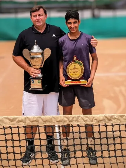 A repeat of a great photo: Tavish with Coach Todd Clark after the U16 Nationals double crown victory.