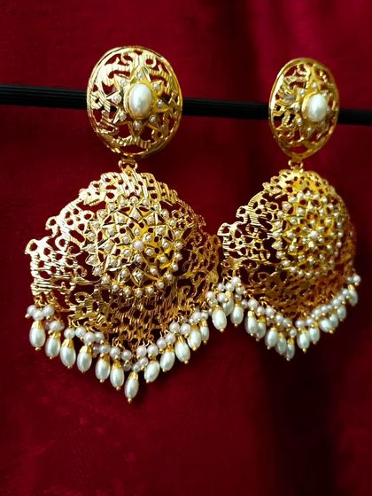 Another angle of the 'सेवंती' (Sevanti) earrings, showcasing the detailed craftsmanship and the beautiful dome shape of the jhumka.