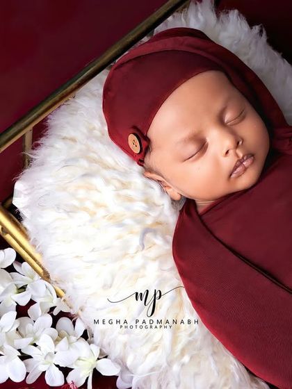 An angled shot showing the baby's tiny feet peeking out.