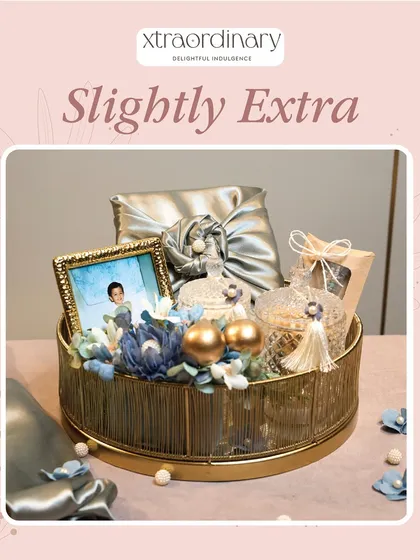 For the sister who is "slightly extra," this luxurious golden hamper with a personalized photo frame is the perfect choice.