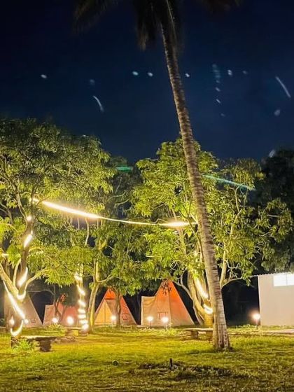 For a more social and budget-friendly vibe, I recommend this delightful hostel in Chikmagalur. It offers a fun, communal camping experience with A-frame tents and fairy lights, perfect for meeting fellow travelers.