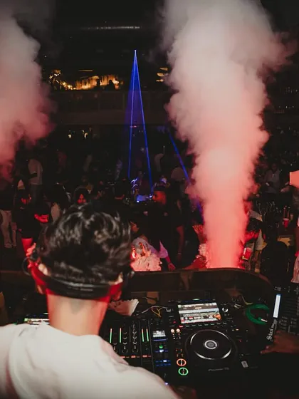 A fisheye lens captures the immersive club environment I create, with me at the center of the music, lights, and smoke.
