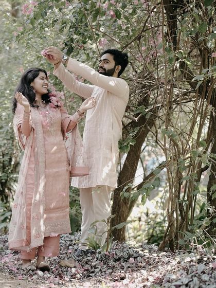 This collection highlights the beauty of traditional Indian attire in pre-wedding photography. You'll see couples in sarees, kurtas, and other ethnic outfits, captured in a variety of settings from natural gardens and architectural sites to vibrant markets.