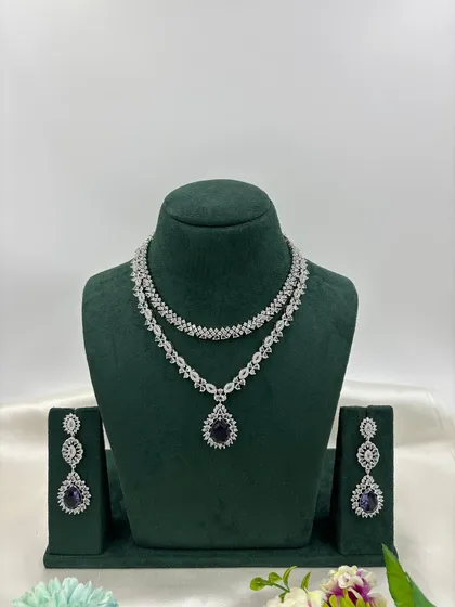 The double-strand AD necklace with a blue pendant.