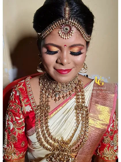This is my signature muhurtham makeover on the lovely Shruthi. The focus is on flawless, glowing skin, warm sunset eyes, and a classic red lip to create a timeless South Indian bridal look.