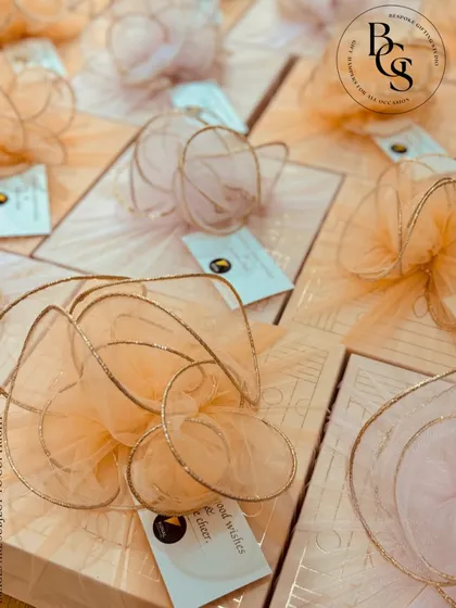 Every hamper we curate is a reason to smile. These beautifully finished peach-toned boxes with delicate tulle bows are a testament to our belief that a gift should be an experience of pure joy.