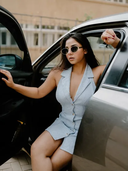 A duplicate of image 475, this creative portrait shot through a car window has an artistic and moody fashion feel.