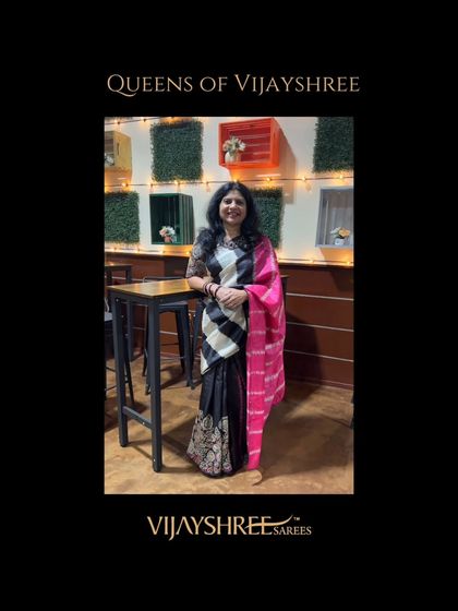 Our client Sumana looking chic and modern in a black and white Kanjivaram with a contrasting pink pallu.