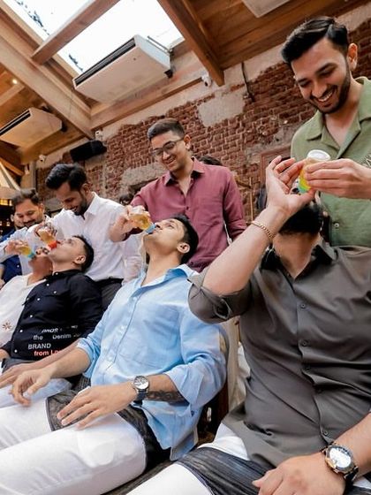 The men get in on the fun too! This hilarious baby bottle drinking game is always a crowd-pleaser and makes for some fantastic photos.