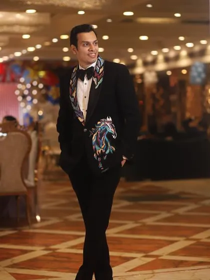 The same client, looking confident and stylish. A great outfit is one that lets your personality shine through, and this bespoke tuxedo does just that.