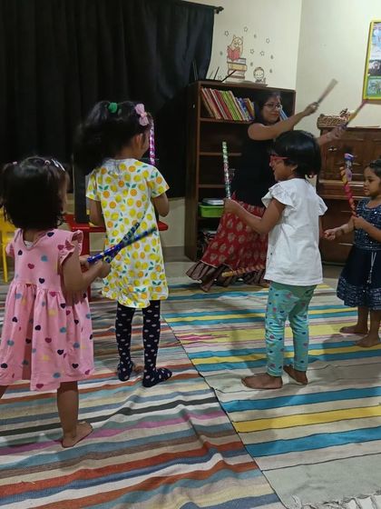 After a story featuring dandiya, the children get their own sticks to dance with. We love connecting stories to cultural traditions and celebrations.