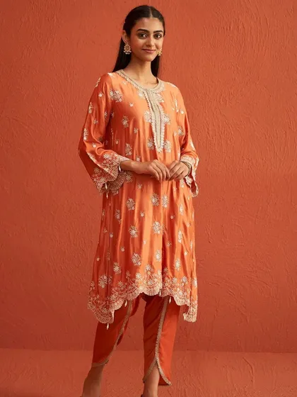 A studio shot of the Kangna Burnt Orange Kurta Set, as seen on Shraddha Kapoor. The dhoti style pants are a modern and comfortable choice.