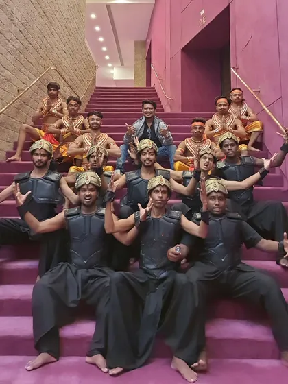 Our choreographer with another group of dancers from "Humare Ram" in their striking black costumes. We coordinate multiple dance troupes and costume changes for a seamless production.