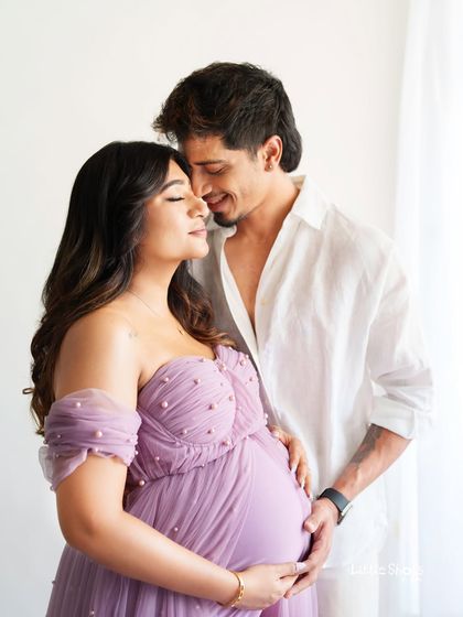 An intimate and romantic close-up of a couple. They are sharing a quiet moment, with eyes closed, highlighting their deep connection during this special time.