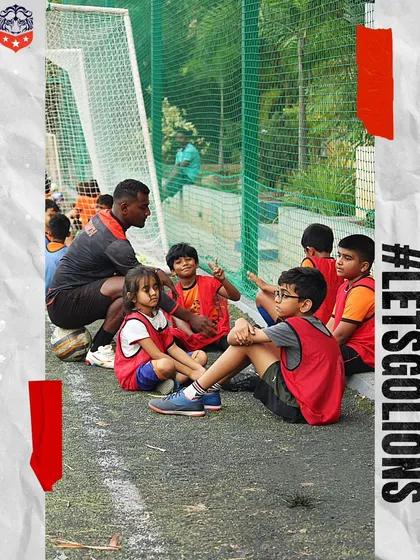 Mentorship is at the heart of our coaching philosophy. A coach takes a moment to speak with our youngest players, teaching them valuable lessons about the game and teamwork.