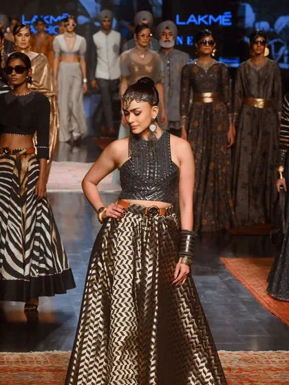 Mrunal Thakur at the head of the model lineup. This image captures her as the showstopper, leading the collection's presentation.