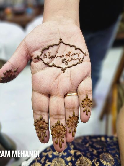 This design is a tribute to a spiritual 'Guru ji'. It's a simple yet powerful way for a groom to carry his blessings with him on his wedding day, complemented by small motifs on the fingertips.