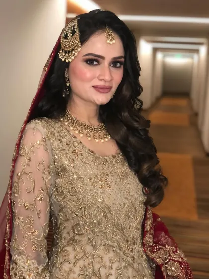A portrait of the Walima bride, showcasing her flawless makeup and glamorous hair.
