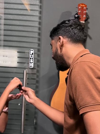 A student shares a piece of cake with her instructor, a sweet moment from one of our studio celebrations.