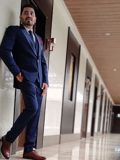 Another look at the blue three-piece suit. I focus on getting the shoulder and waist measurements just right, so the jacket hangs perfectly.