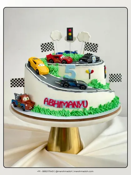 Who says you need fondant for a fun theme? This 3kg car-themed cake is covered in my signature, silky buttercream. Inside, it's packed with rich chocolate layers and my special in-house orange marmalade.