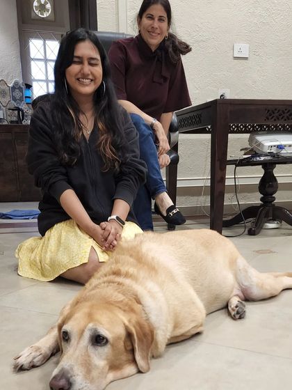 With my mentor, Shirin Merchant, and a furry friend. Her teachings on canine behavior form the foundation of my empathetic and positive training methods.