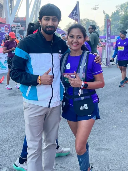 With a fellow runner at a marathon event. The running community is vast, and it's always great to connect with other passionate individuals.