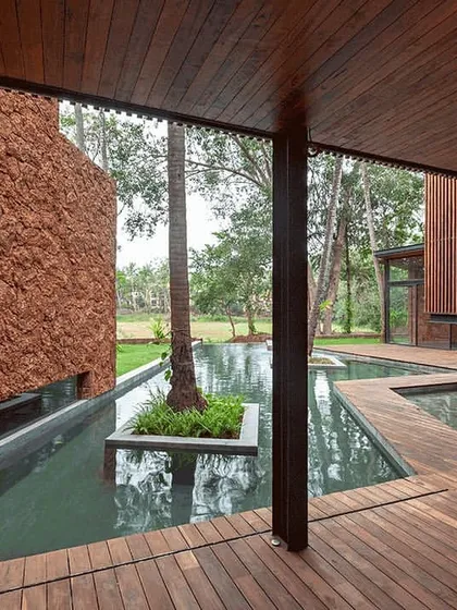 The interplay of wood, water, and stone in this villa courtyard. This image captures our love for creating serene, private oases that allow residents to slide into nature and enjoy a moment of calm.