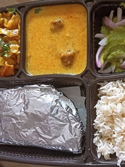 A simple and light thali with kadi pakoda and bandgobhi (cabbage) sabzi. A perfect meal for a hot summer day.