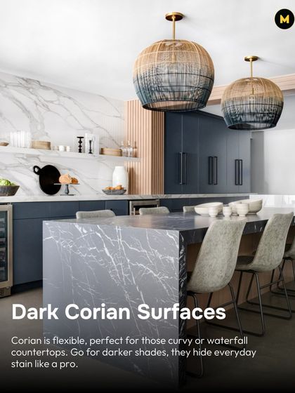 Dark Corian surfaces are flexible and can be shaped for curvy or waterfall countertops. The darker shades are also great at hiding everyday stains, making them a practical choice for a hardworking kitchen.