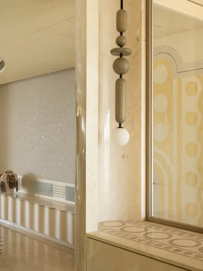 This whimsical floor lamp, reflected in a mirror, adds a playful touch to the home office. Its curved, looping forms are a perfect example of how we like to incorporate sculptural lighting that doubles as art.