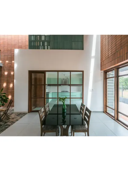 Our project 'An Earthy Affair' was recognized as a Runner Up for Large Residential Interior at the IIID Design Excellence Awards. This image shows the dining area and its connection to the outdoors.