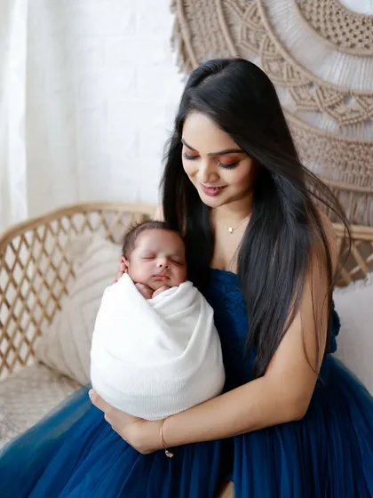 A mother's loving embrace. This portrait focuses on the intimate bond between mother and child in a serene, beautifully lit setting.