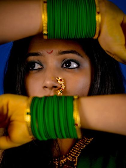 A powerful shot from my styling portfolio, focusing on traditional Marathi accessories. The green glass bangles and the classic nath (nose ring) are iconic pieces that tell a rich cultural story.