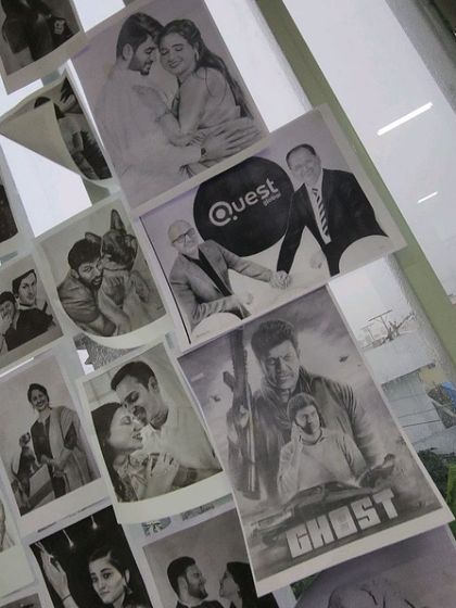 A close-up of some of the sketches on my art wall, including the 'Ghost' poster and a corporate piece for Quest.